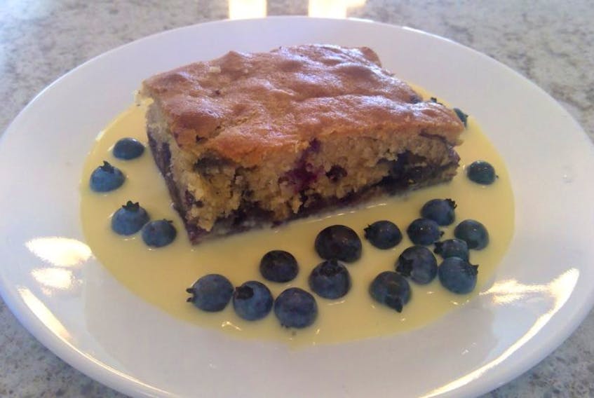 Blueberry honey cake really deserves to pair with vanilla custard sauce.