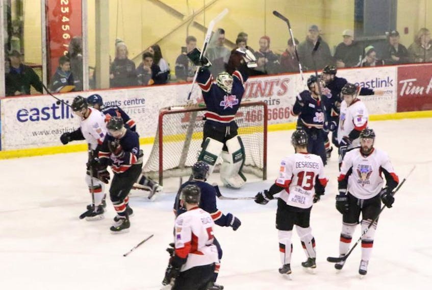In this April 2, 2017 file photo, CeeBees goalie A.J. Whiffen raises his arms in celebration amid dejected members of the Central West Senior Hockey League’s Clarenville Caribous at the conclusion of Game 5 of the Herder Trophy provincial senior hockey championship Sunday in Clarenville. Just five months after winning a Herder for the Avalon East Senior Hockey League, the AESHL’s other four teams have told the CeeBees they are no longer wanted in the circuit. Meanwhile, the CWSHL is looking for a new team, but the CeeBees’ president says a hook-up with the CWSHL is far from his team’s preferred option.