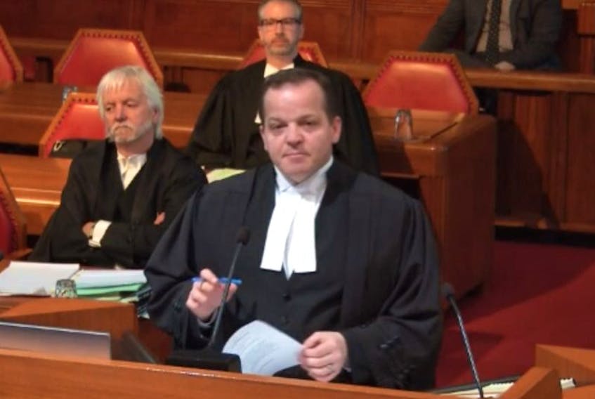 St. John’s Crown prosecutor Lloyd Strickland presents his arguments in the Hickman Equipment fraud case to a seven-judge panel at the Supreme Court of Canada in Ottawa Tuesday. Defence lawyer Randy Piercey (left) and Jon Noonan (background) also spoke at the hearing on behalf of their clients, former senior managers in the now-defunct company.