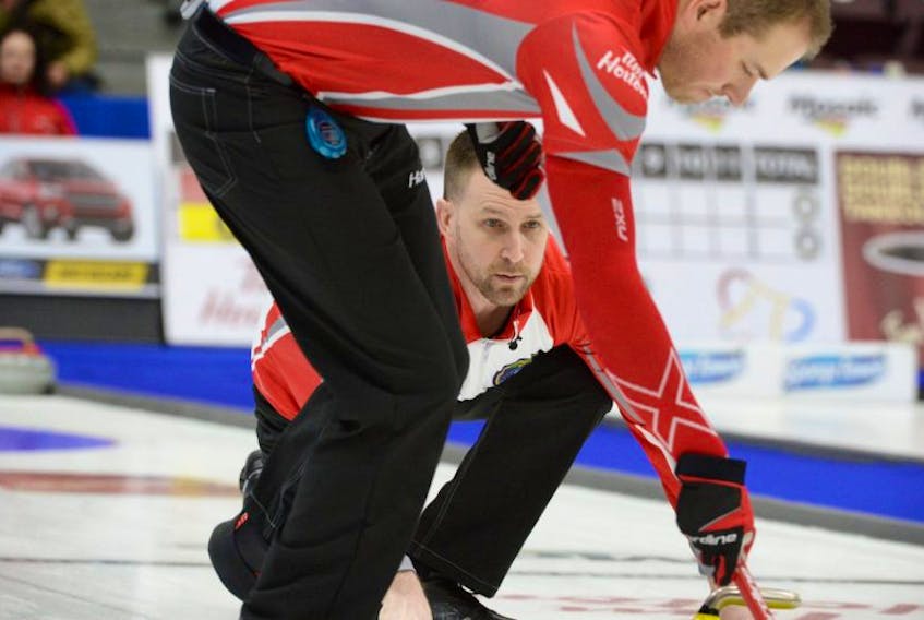In this file photo, skip Brad Gushue delivers a rock for sweeper Geoff Walker (top) during play at the 2017 Brier Canadian men's curling championship at Mile One Centre in St. John's. Both Gushue and Walker have recovered well from injuries that trouble them last season. That's shown in early results from the 2017-18 curling campaign, including at the Tour Challenge in Regina, where the team is 2-0 so far.