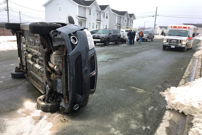 A quiet St. John’s street was the scene of a vehicle rollover Saturday morning. Keith Gosse/The Telegram