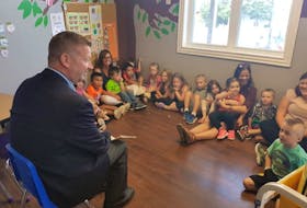 Education Minister Dale Kirby speaks to children at the Pitter Patter Daycare in Conception bay South Thursday. Kirby was at the daycare to announce increases to the provincial child care subsidy.