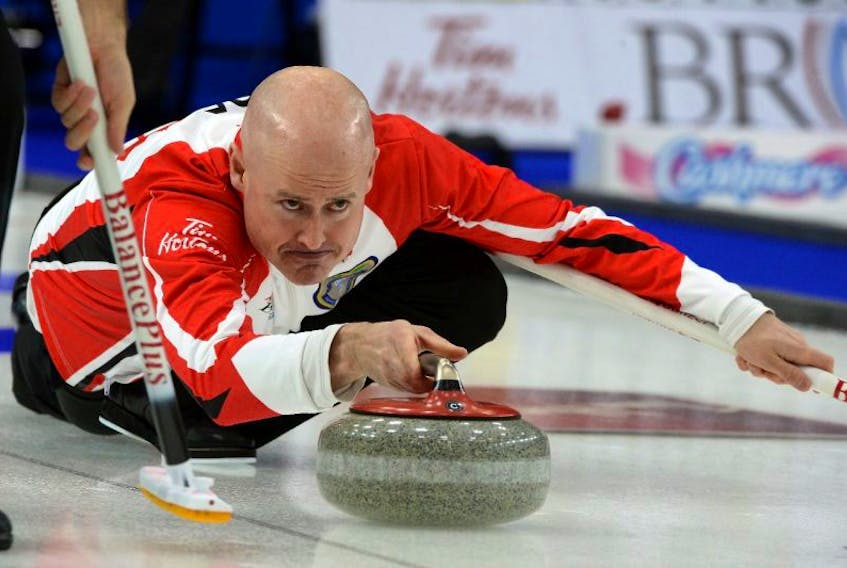 ['Team Canada skip Kevin Koe throws a rock during the Sunday morning draw of the Brier at Mile One Centre.\n\n']