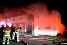 Firefighters rescued two men from the roof of burning home early Monday morning in St. John's. Keith Gosse/The Telegram