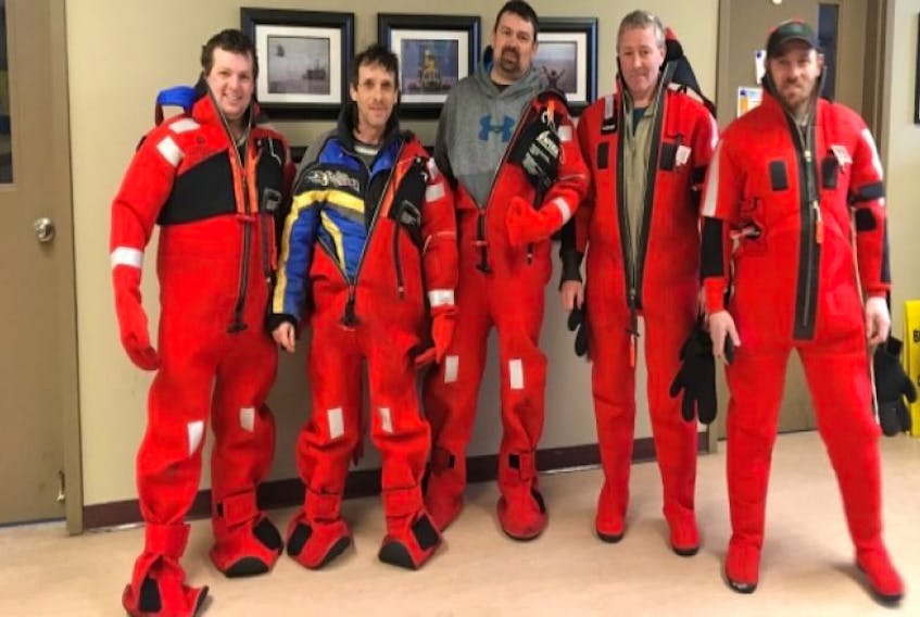 The crew of the Northern Provider, (L-R) Frank Brown, Junior Brown, Dion Rideout, skipper Brian Anstey and Lorne Hawkins, were rescued from dangerous sea conditions near St. John's Sunday. Some of the sealers are headed back to sea today to retrieve their boat. 
