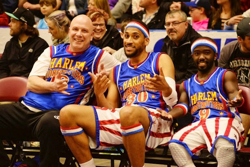 Steve Bartlett (left) with Zeus McClurkin and Hot Shot of the Harlem Globetrotters.