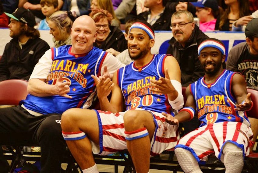 Steve Bartlett (left) with Zeus McClurkin and Hot Shot of the Harlem Globetrotters.