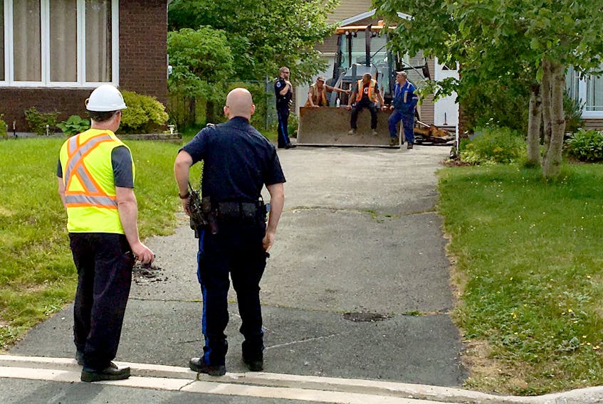 One man was taken to hospital Wednesday evening when a pole fell on him during a home paving operation. Keith Gosse/The Telegram