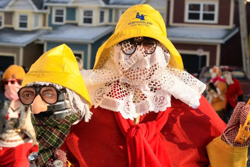 ["Hundreds of mummers banded together Saturday in St. John's for the annual Mummers Parade."]