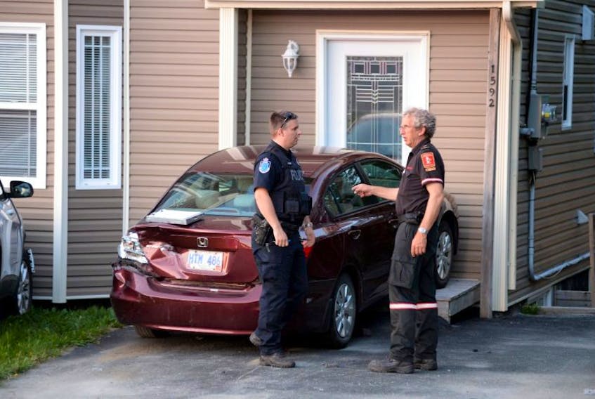 Three people were sent to hospital Friday evening following a three-vehicle collision in Portugal Cove that saw one car crash onto the porch of a nearby home. 