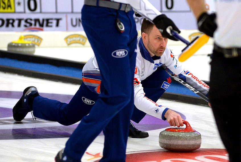 Brad Gushue throws a stone Tuesday night during the Pinty’s Grand Slam of Curling: Boost National event at the CBS arena.