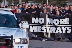 Friends and family march at a service to honour the 26 coal miners who perished in the Westray mine disaster at the Westray Miners Memorial Park in New Glasgow, N.S., May 9, 2017. 