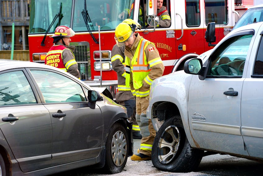 Emergency personnel tend to a two-vehicle collision on Thorburn Road Friday night. Keith Gosse/The Telegram