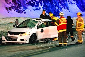 Two people were taken to hospital after a car overturned on the Team Gushue Highway early Tuesday morning. Keith Gosse/The Telegram