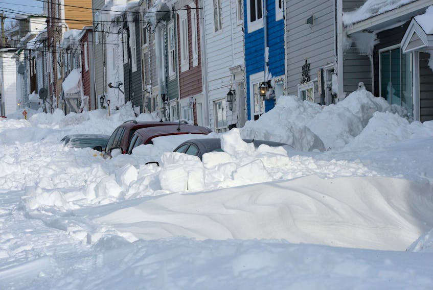 Vehicles sit buried in downtown St. John’s Sunday following Friday’s record-breaking storm. Keith Gosse/The Telegram