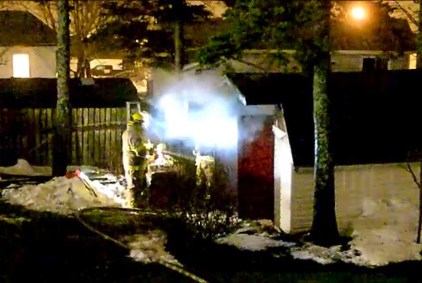Firefighters extinguish a shed fire in Mount Pearl early Monday morning.