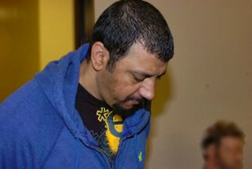 ['Suspected serial rapist Sofyan Boalag is led into the courtroom at provincial court in St. John’s in this file photo.']