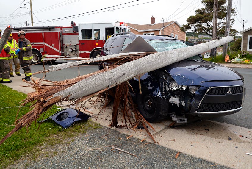A woman fled the scene on foot early Sunday morning after she crashed her vehicle into a pole and cracked it off. Keith Gosse/The Telegram