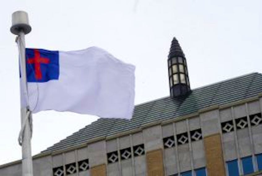 ['The unofficial Christian flag raised in March at Confederation Building by the St. Stephen the Martyr church group.']