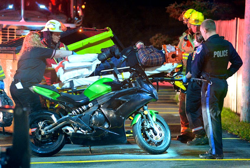 A motorcyclist was taken to hospital early Monday morning after he was found under his overturned bike by a passerby. Keith Gosse/The Telegram