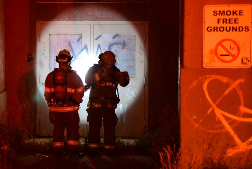 A small fire at the former Booth Memorial high school on Freshwater Road Thursday night saw firefighters respond to the scene. Keith Gosse/The Telegram