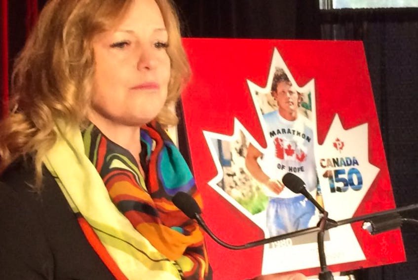Judith Fox, sister of Terry Fox, unveils the Canada 150 stamp commemorating Terry's 1980 Marathon of Hope.