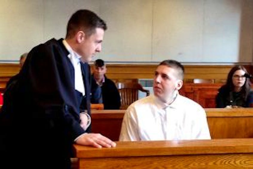 ["<p>Co-defence counsel Johnathan McDonald talks with accused murderer Ray Stacey prior to Stacey's bail hearing at NL Supreme Court on St. John's. — Photo by Rosie Mullaley/The Telegram</p>"]
