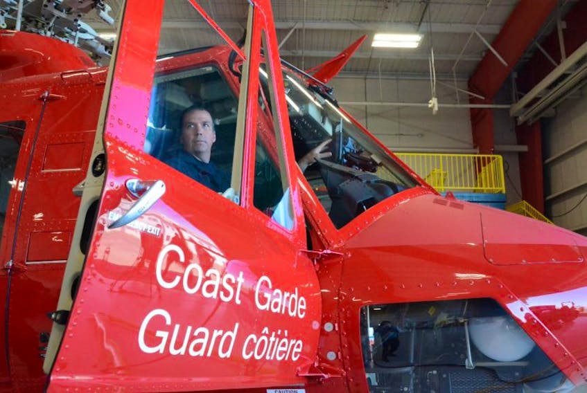 Don Dobbin, a pilot from Wabush, sits in the Canadian Coast Guard’s brand new medium-lift helicopter.