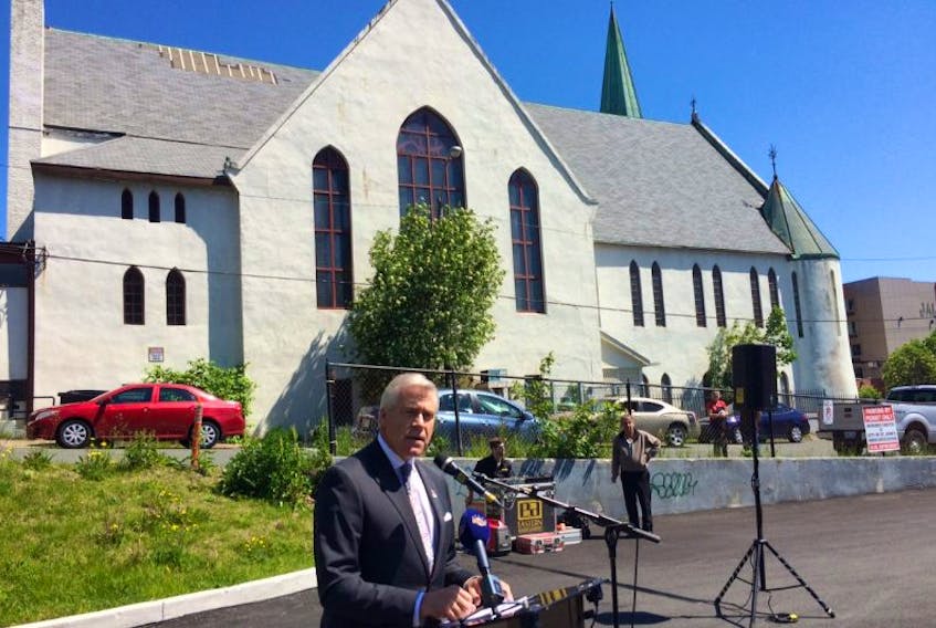Premier Dwight Ball is shown on the site of what will be the new Salvation Army Centre of Hope on Springdale Street, St. John's, in a funding announcement Friday for the facility's construction.