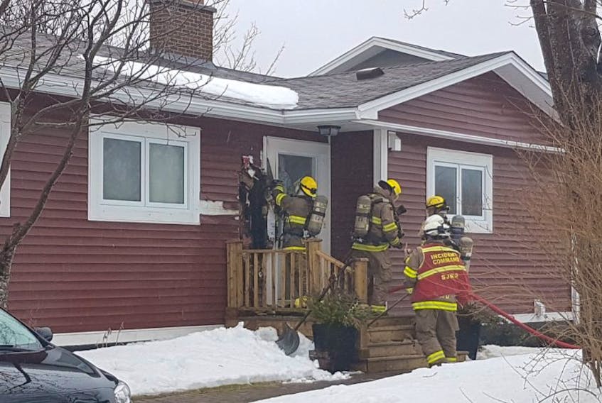 Firefighters on the scene at London Road, St. John's Friday.