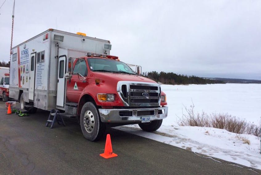 Rovers Ground Search & Rescue truck command post is parked near by Three Island Pond in Paradise Monday as part of a continuing search connected to a home invasion in the community last week.