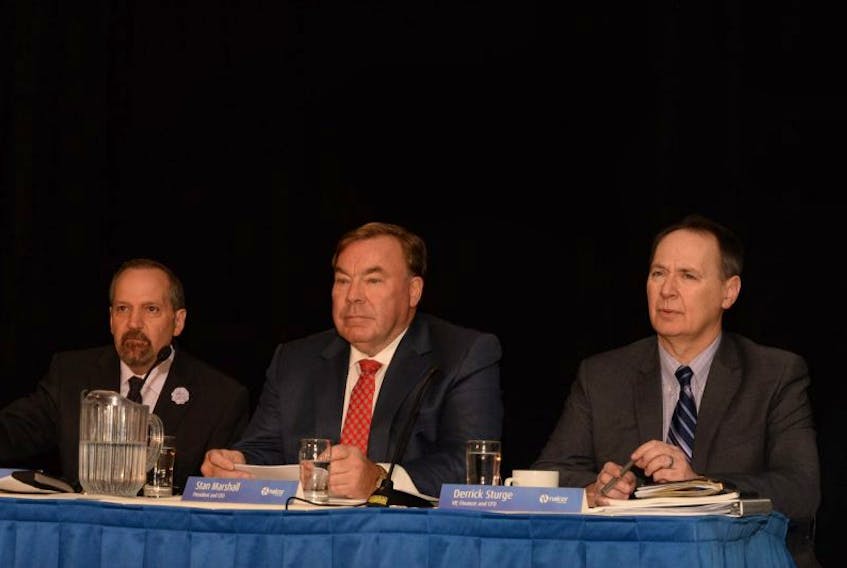 (From left) Brendan Paddick, chair of the Board of Directors, Stan Marshall, president and chief executive officer and Derrick Sturge, executive vice-president of finance and Chief Financial officer await the start of Nalcor's AGM in St. John's Thursday.