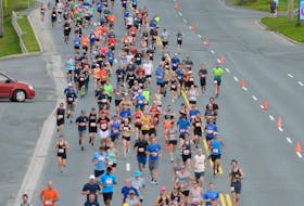 Participants stream down Topsail Road during the 2019 Tely 10 Road Race. The ongoing global COVID-19 pandemic has called into question whether or not this year's race will go ahead. Organizers would prefer to postpone the event to this fall, rather than cancel.