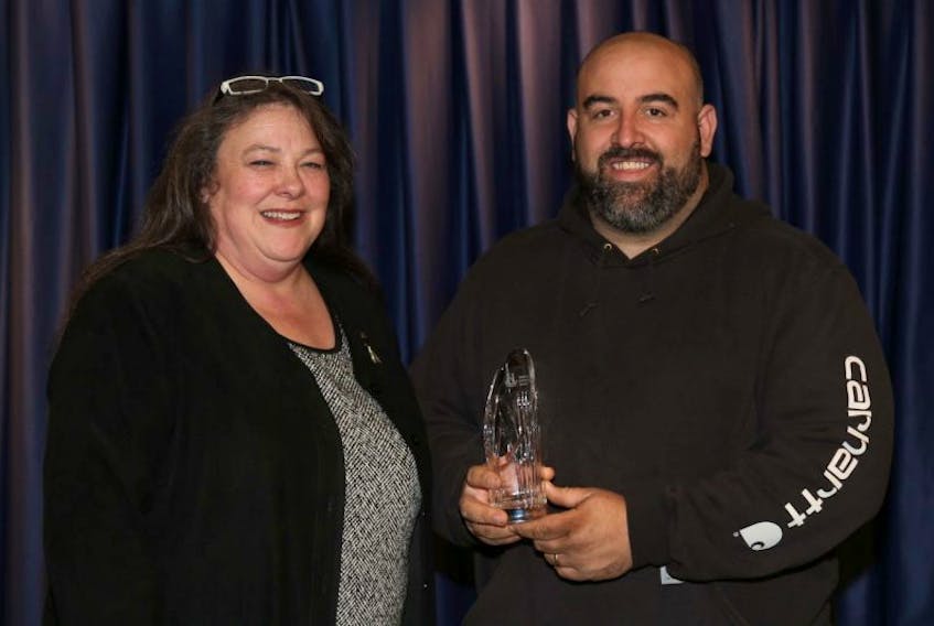 <p>Hants County Community Access Network executive director Kim Aker congratulates Terry Brown, of Brown’s Garage, for receiving the Lieutenant Governor’s Persons with Disabilities Employer Partnership Award. (Submitted photo)</p>