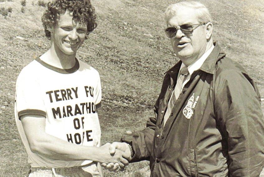 Terry Fox chats with former Casket sales manager Blaise Cameron on a stop, while travelling through Antigonish County on his iconic Marathon of Hope in 1980. File