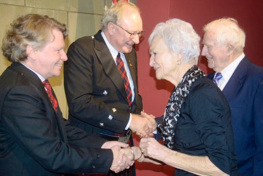 Duncan McIntosh and Wade MacLauchlan greet Eileen and Stan Moore during the premierâs levee held inside the Confederation Centre of the Arts Sunday.