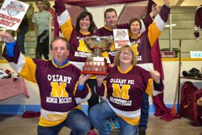 ["Members of the O'Leary Hockeyville committee celebrate the town's win Saturday night."]