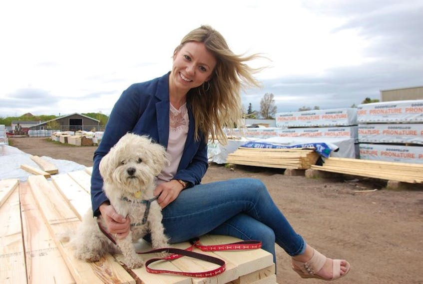 Jillian Sexton and her dog, Bo, have become a fixture lately at the former Sherwood BMR in Charlottetown. Sexton hopes to make the struggling building materials store a success as Sherwood Timber Mart.