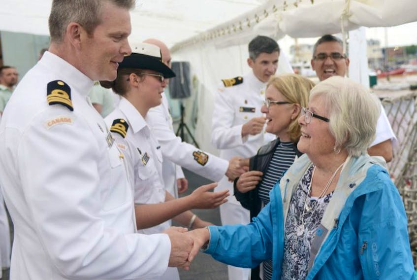 Marilyn Whyte, of Sydney N.S., is greeted onboard the HMCS Charlottetown by CO Jeff Hutt during a Canada Day reception. The ship was in town for three days of public tours while Whyte was invited onboard the ship to recognize her father, Lt.-Cmdr. John Willard Bonner, who captained the first HMCS Charlottetown and died when it was torpedoed in 1942.
