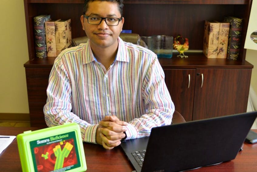 Somru BioScience Inc. co-founder Mohammed Moin, sees the Charlottetown-based company becoming a world leader in several bioscience areas. The green box on Moin’s desk is a sample biomarker laboratory test kit that will be exported to Bangladesh as part of a joint venture with Radiant Pharmaceuticals.