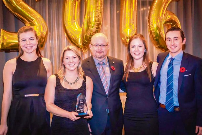 From left are Hannah Dawson, Shanna Blacquiere, Krista Lee Oliver and Carter MacDonald receiving their award from Craig Levangie, centre, director and group lead for Nova Scotia for commercial banking at Scotiabank.