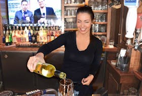 Olivia McGuigan pours a glass of wine at Hunter’s Ale House in Charlottetown. The restaurant/bar has added ‘guardian shots’ to its menu. That’s not a dish or a drink. It’s code for a customer who wants help.