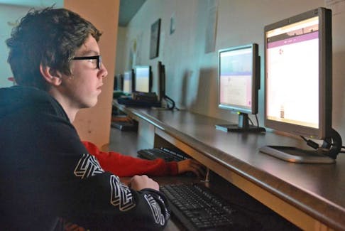 Caleb Perry works on recreating an avatar during the Hour of Code project his class was taking part in recently at Kinkora Regional High School