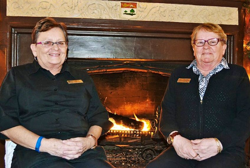 Bernie Carragher, left, and her sister, Pat Toombs, have a combined 98 years of service at what is now known as the Rodd Charlottetown Hotel on Kent Street.