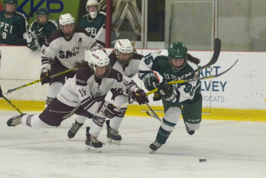 UPEI Panthers rookie forward Faith Steeves, right, tries to fight off the check of Saint Mary’s Huskies forward Gemma MacDonald during Saturday’s Atlantic University Sport women’s hockey game at MacLauchlan Arena. MacDonald, a Blooming Point native, is in her third season with the Huskies.