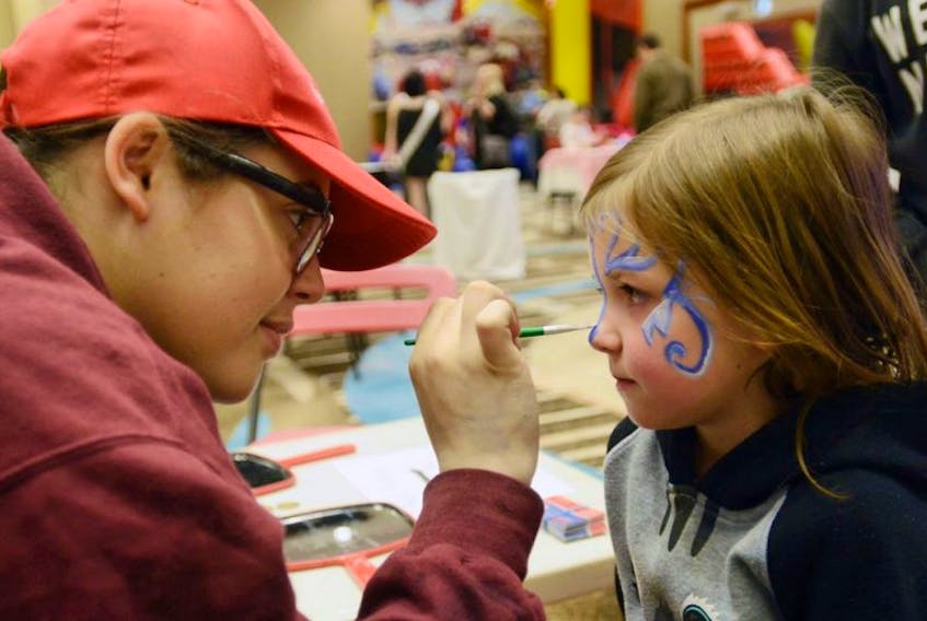 Mara Duncan, 5, gets her face painted by Bridgette Casford of Par-T-Perfect at the remote broadcast site for the IWK Telethon for Children in Charlottetown. Duncan, a Stratford resident, celebrates at the Charlottetown telethon site almost every year after being born at the IWK and receiving amputated foot surgery at the hospital.