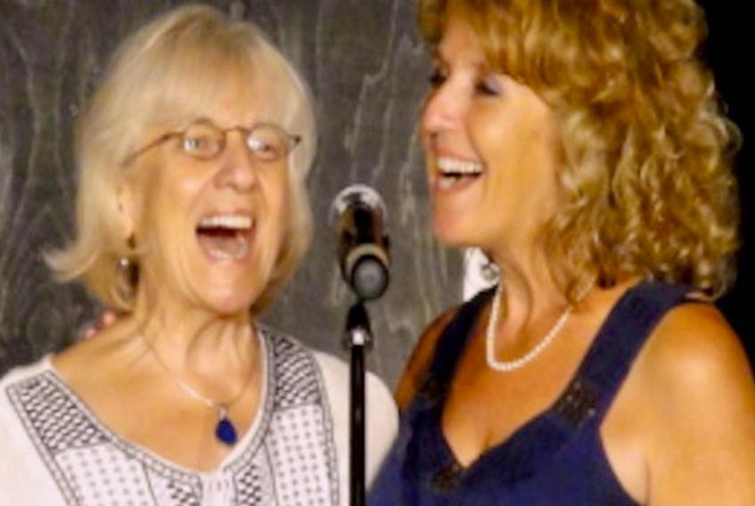 Jeanette Arsenault, right, singing with her aunt Angèle Arsenault.