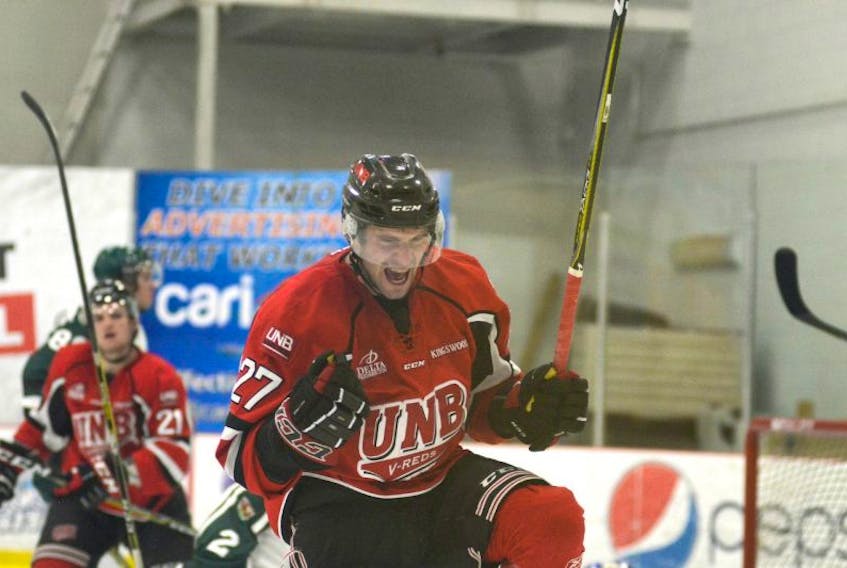 UNB Varsity Reds forward Stephen Anderson, a Morell native, celebrates his first of two goals Friday against the UPEI Panthers at MacLauchlan Arena.