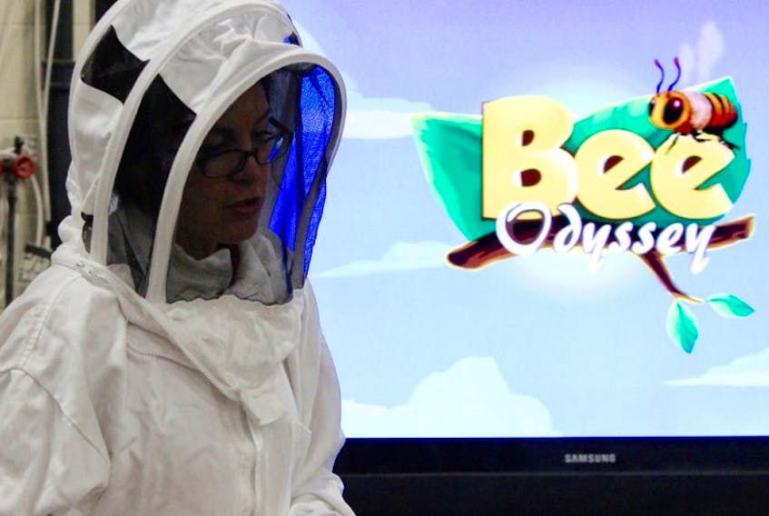 Nadine Dagenais-Dessaint sports her beekeeping outfit while talking to students about her experience with bees during a recent Agriculture Adventure Days at the Eastlink Centre in Charlottetown.