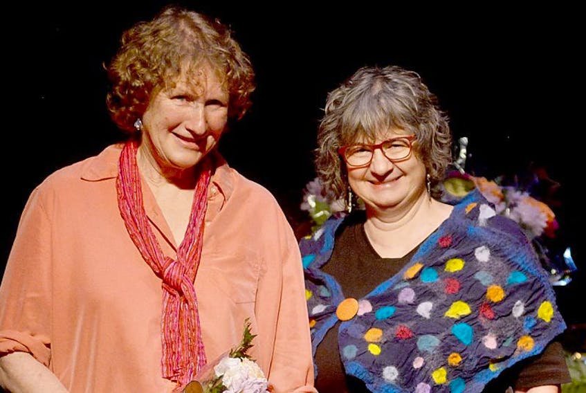 Island author Louise Burley, left, accepts the Susan Buchanan Creative Non-Fiction Award from Laurie Brinklow, co-ordinator of UPEI’s Institute of Island Studies, during the 30th Cox and Palmer Island Literary Awards held at The Mack on Saturday. The awards show was the penultimate event for the Reading Town P.E.I. Festival.